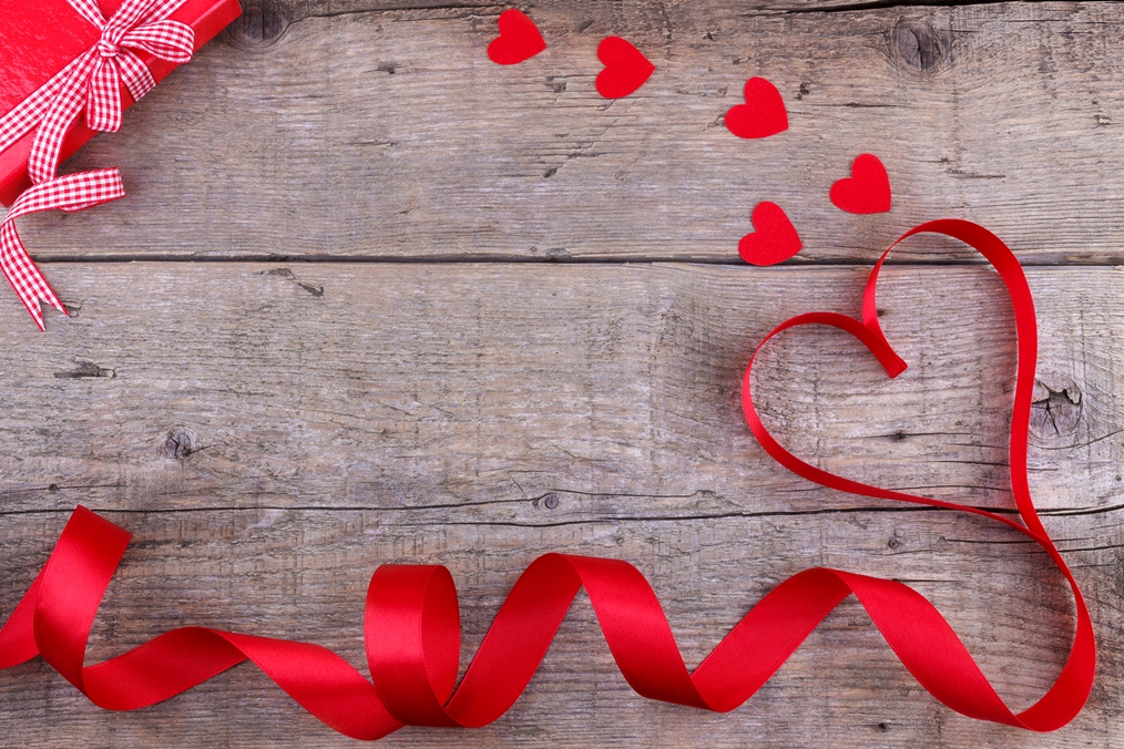 Gift box and heart shaped ribbon